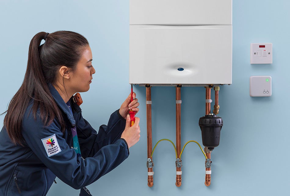 Service engineer fixing a boiler