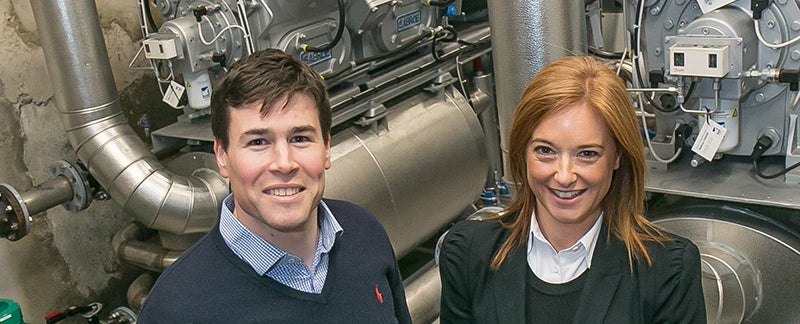 Paul Grant and Deirdre Threadgold standing in front of machinery