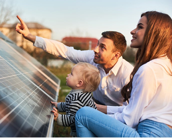 Young family with solar panels