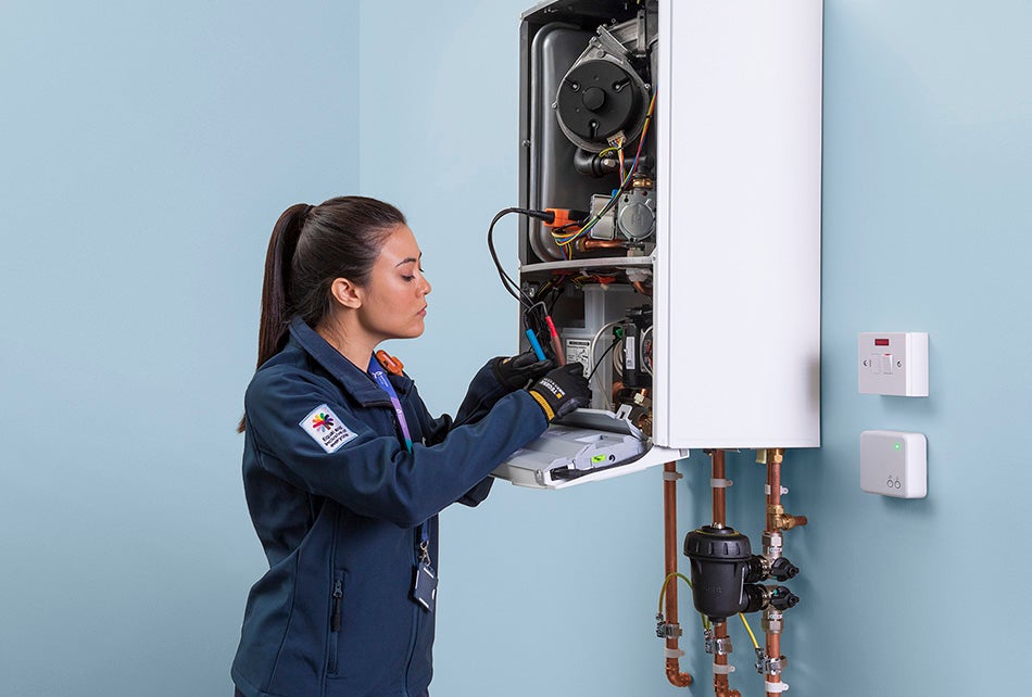 Service engineer fixing a boiler