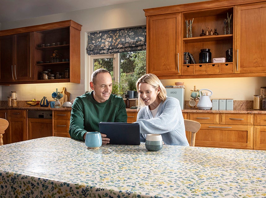 Male and female couple at a laptop
