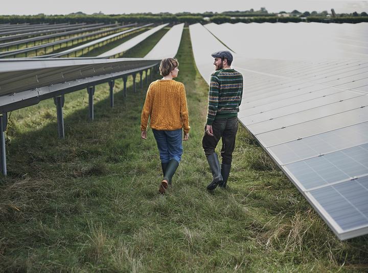 Man and woman on solar farm
