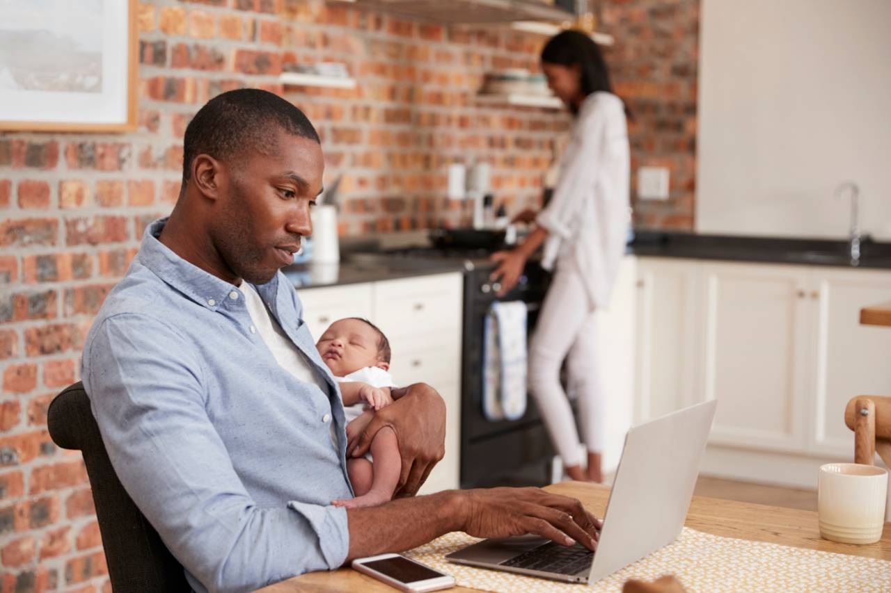 Couple with baby in kitchen