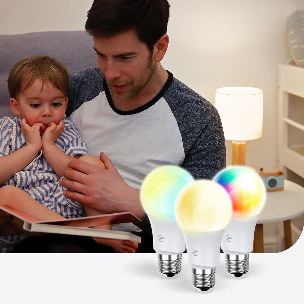 Father reading son a story with smart lightbulbs in front of them.