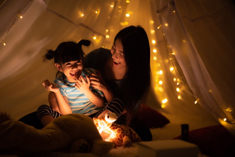 Mother and daughter playing.