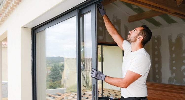 Man fitting windows