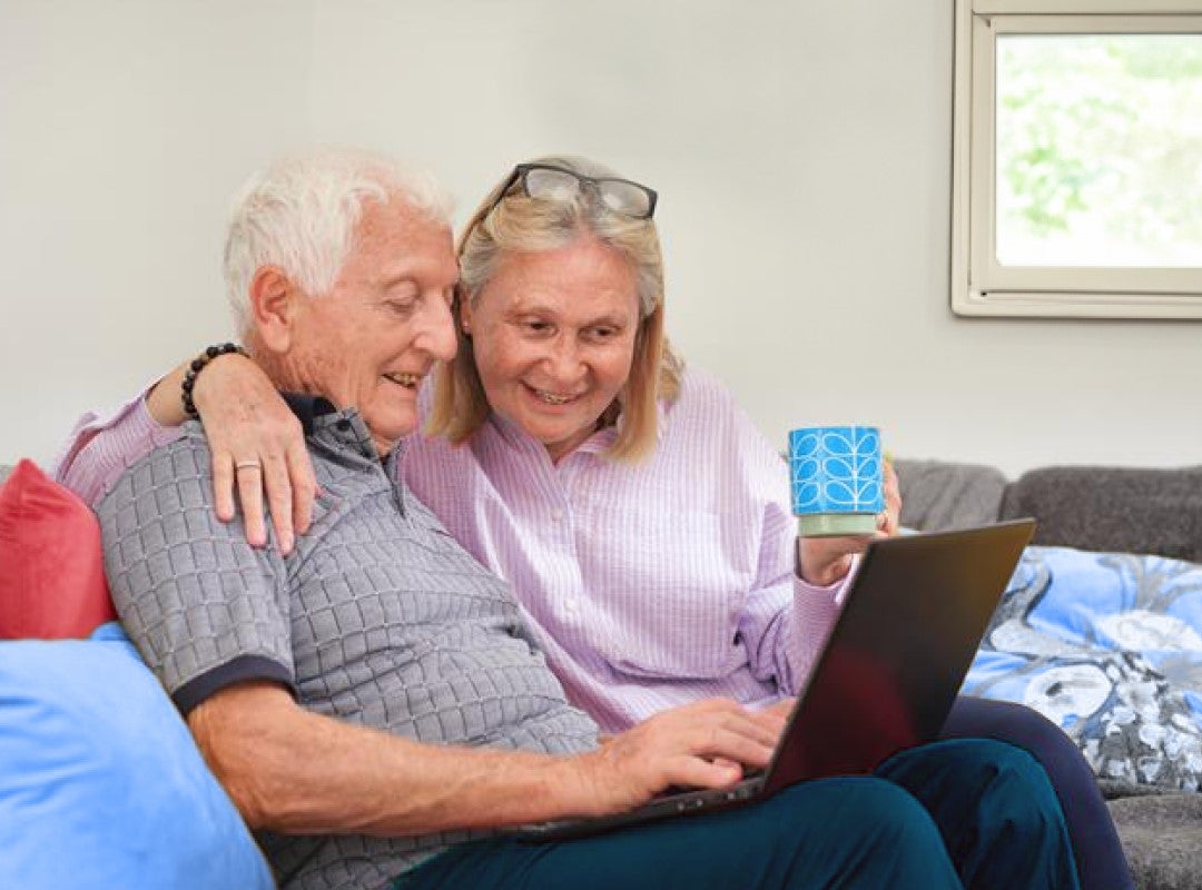 Elderly couple on laptop