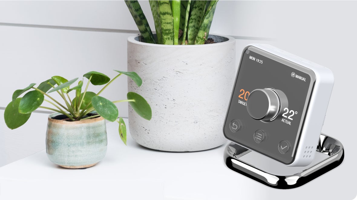 Smart meter next to potted plants