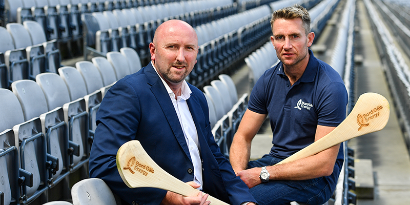 Brian Corcoran and Eddie Brennan sitting in an empty stadium
