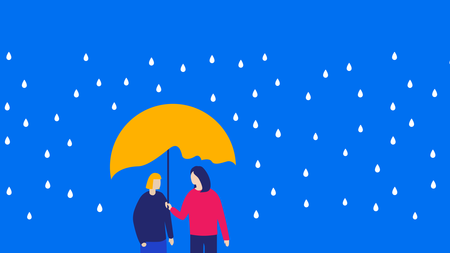 Picture of a person standing under an umbrella with rain