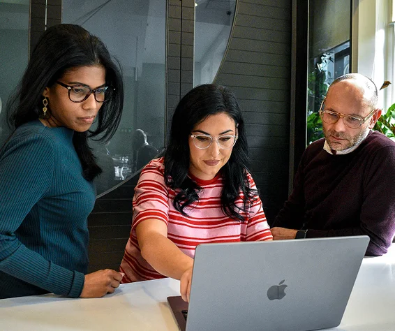 people looking at a laptop