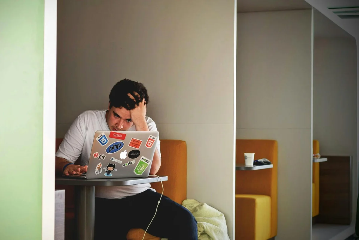 man stressed at computer