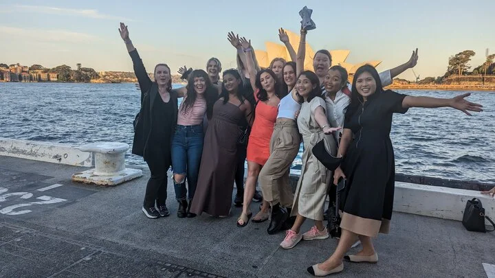 Group photo of Luminary team standing in front of Sydney opera house   