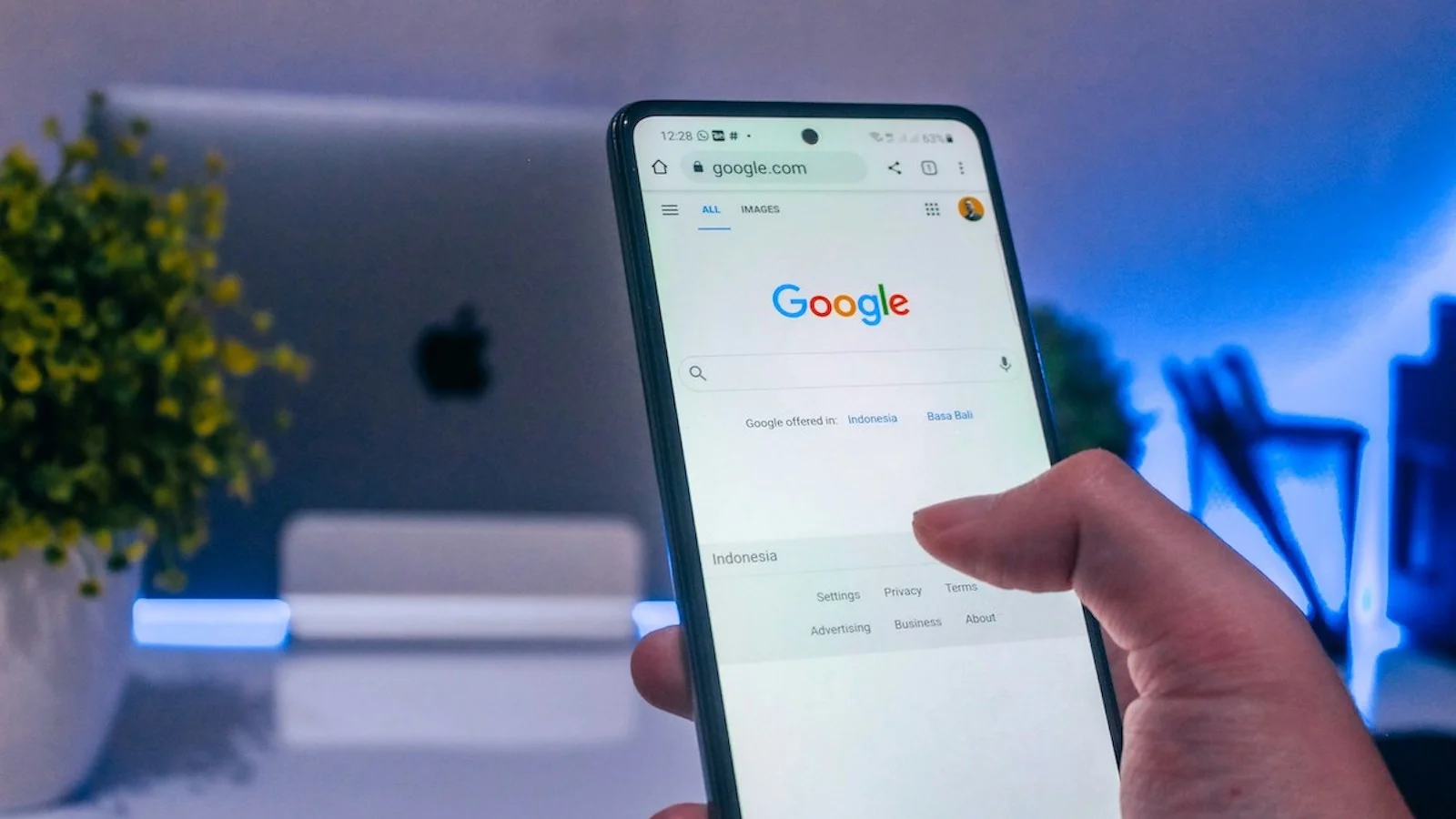 Picture of a person holding a phone