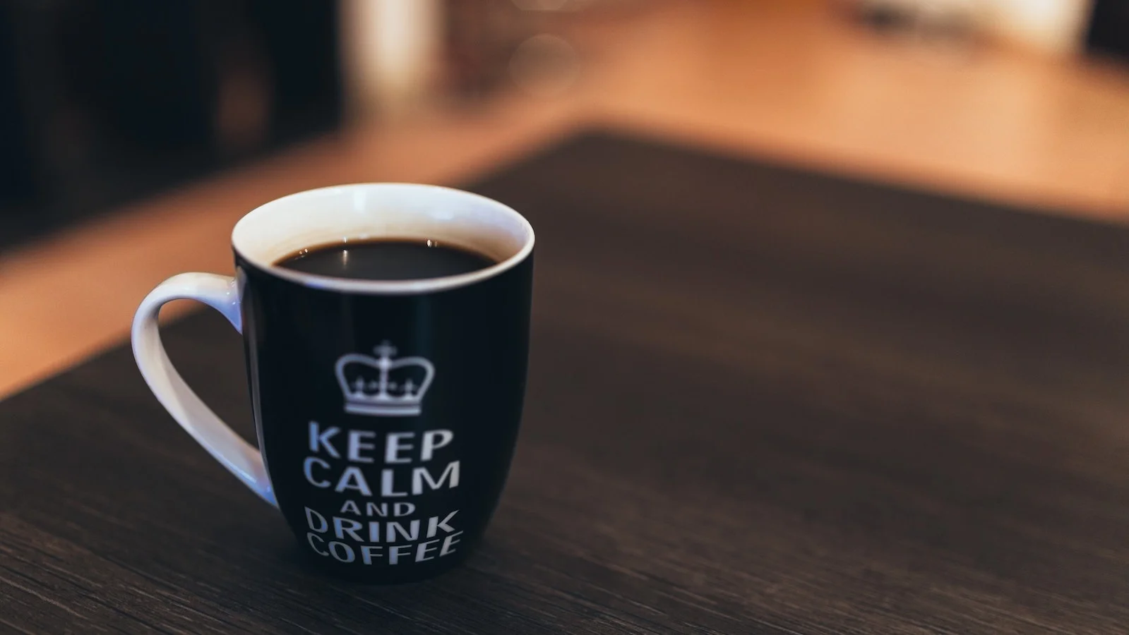 Coffee cup with Keep Calm And Drink Coffee written on it