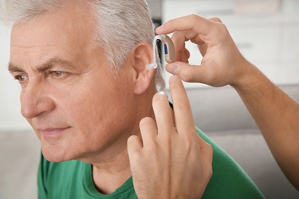 Remote Monitoring Blog Image of Man with Medical Hearing Device