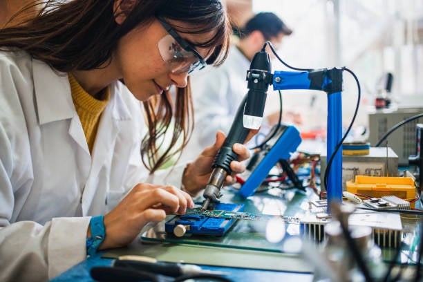 female engineer working on a circuit