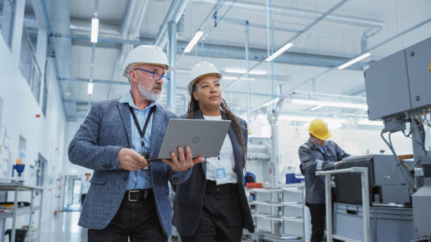 pair of engineers in a factory