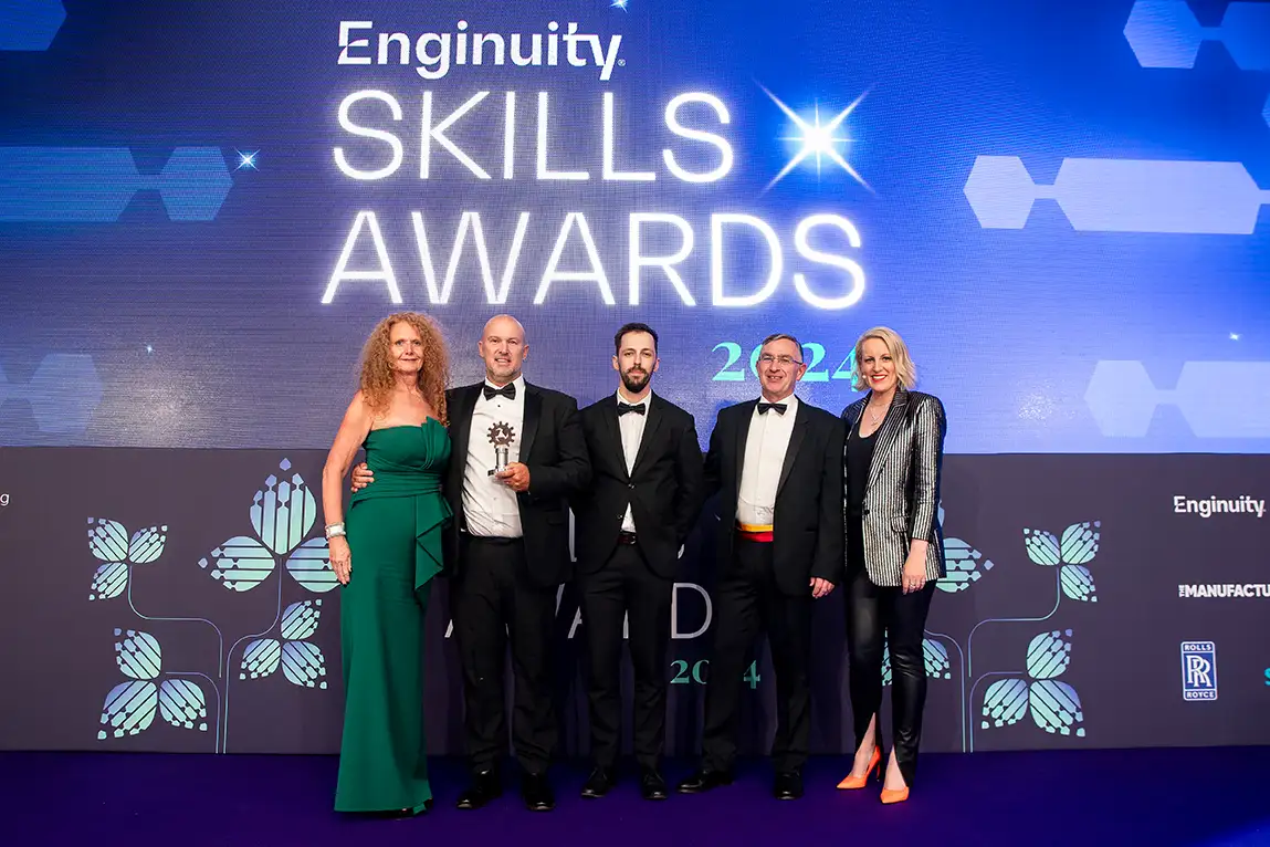 A picture of award winners collecting their award for Training Partner Skills Champion of the Year at Enginuity Skills Awards 