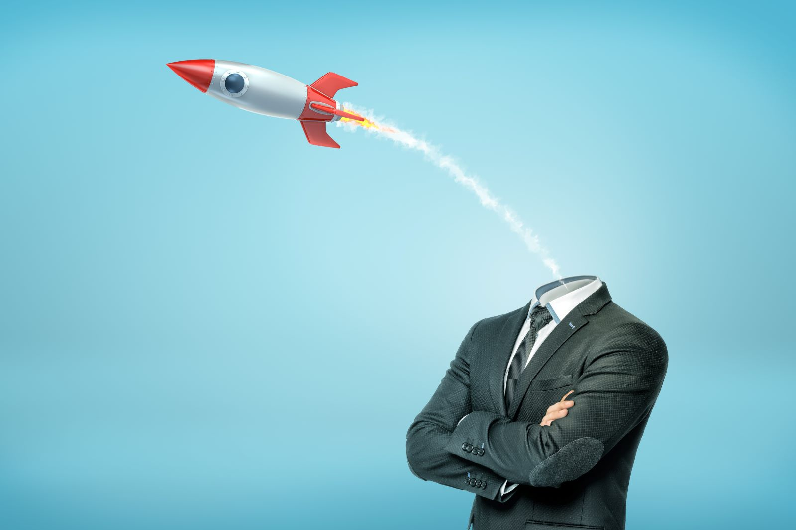 Rocket flying out of headless man in suit