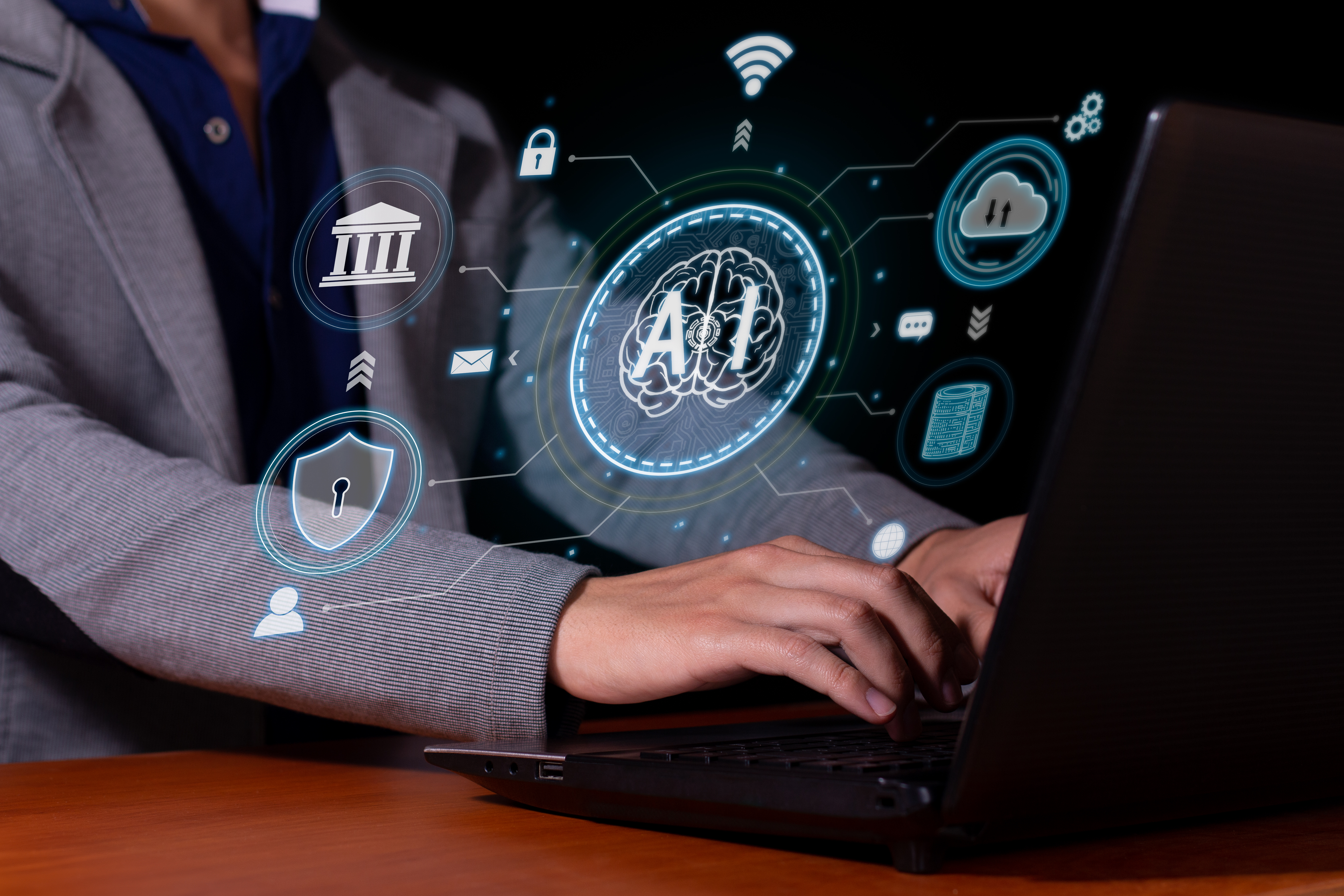 Man on laptop with AI digital icons