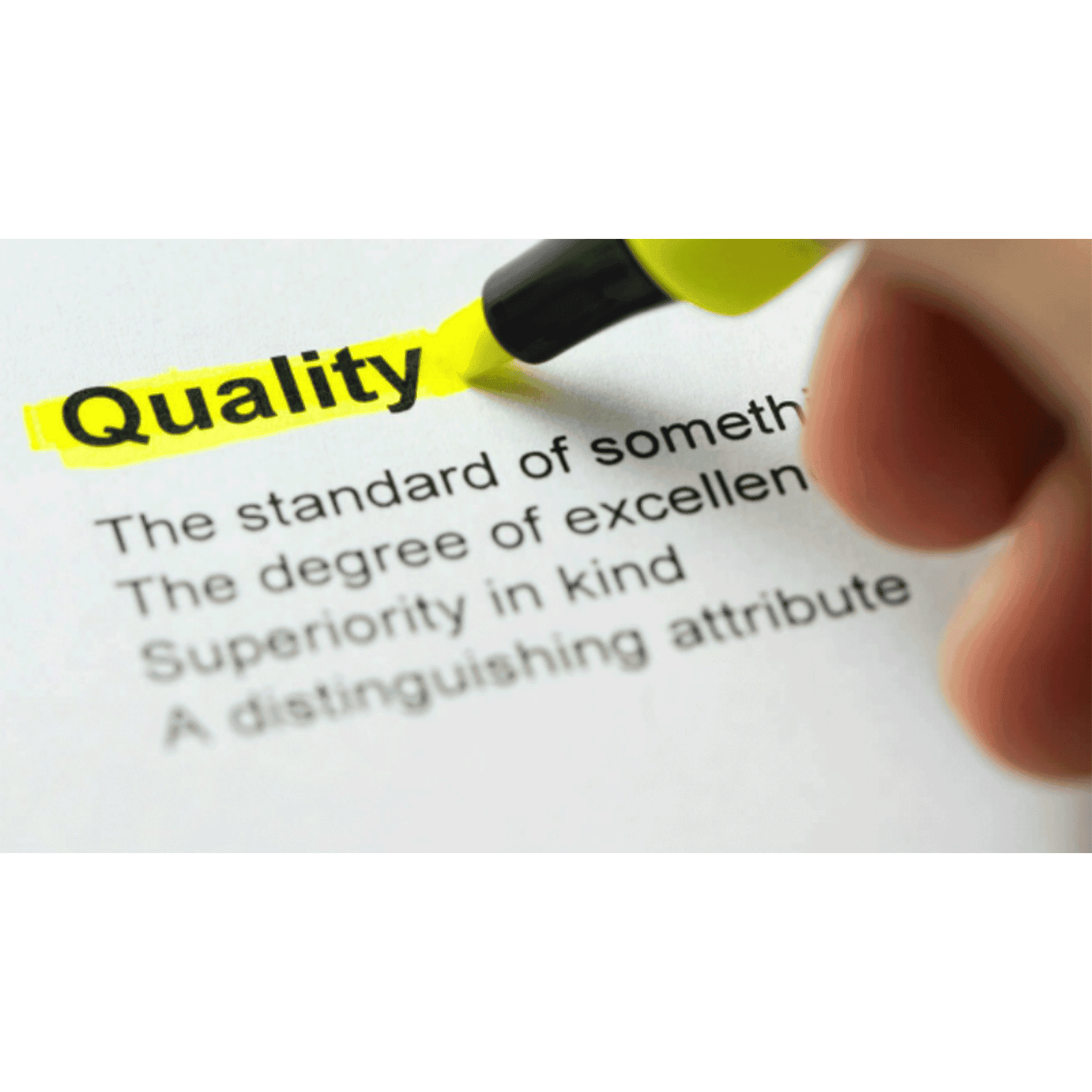 Close up of person highlighting the word "quality" in book
