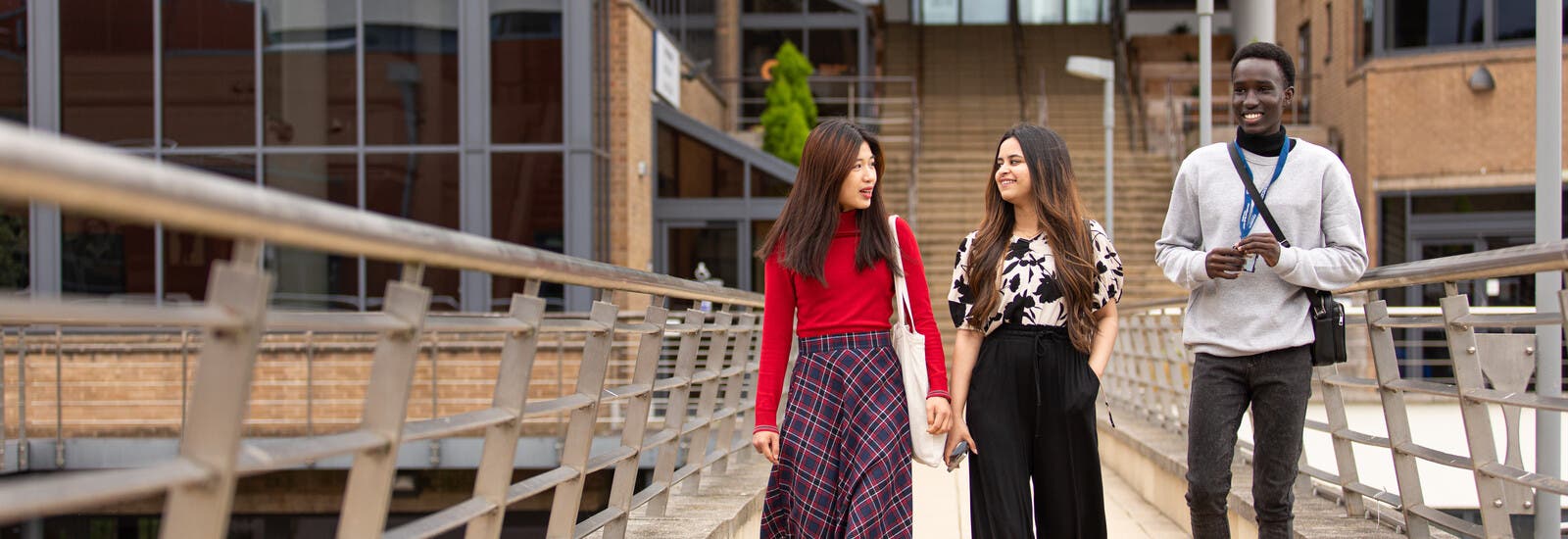 Students walking outside Huddersfield campus
