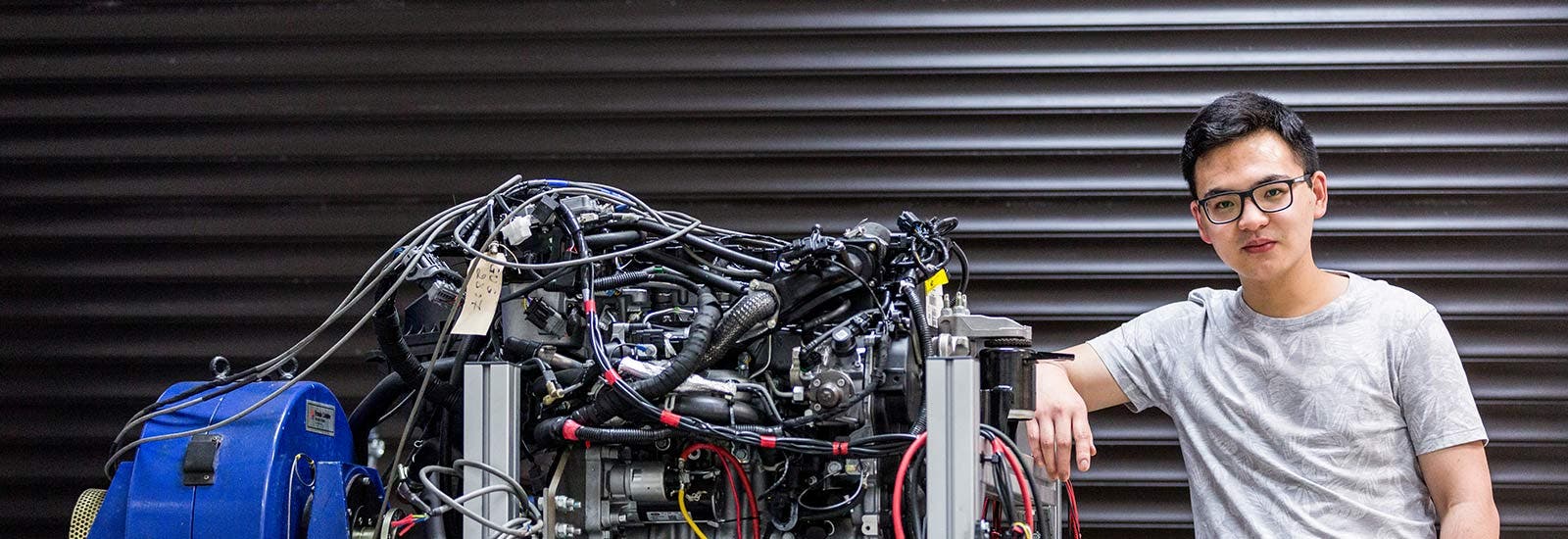 Student next to engineering project
