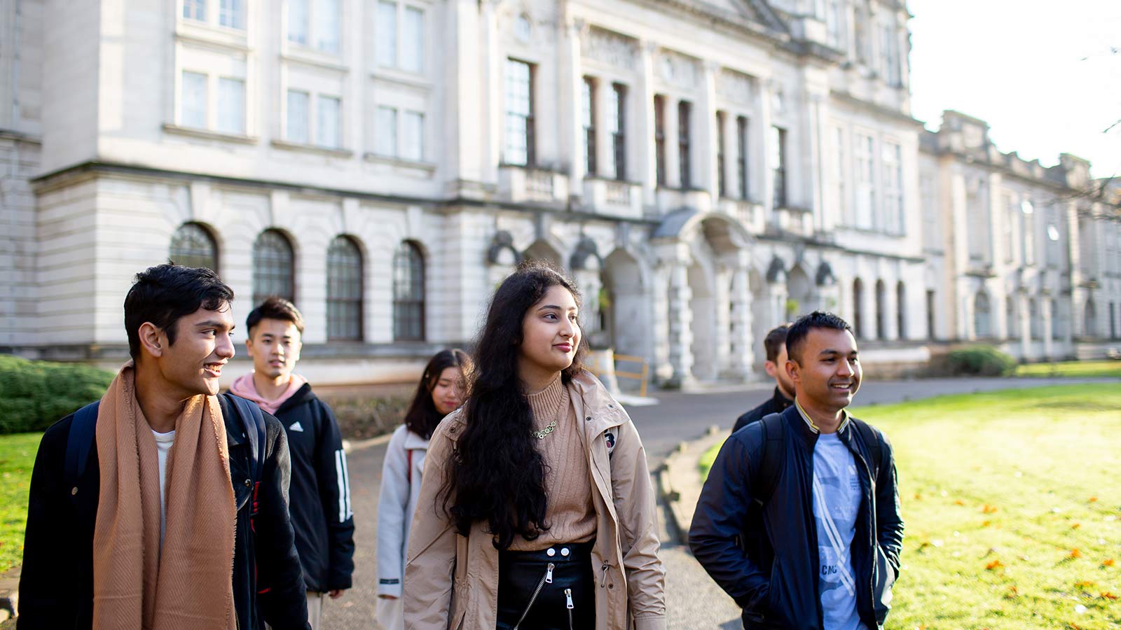 Cardiff University students walking through the campus