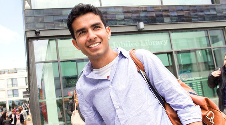 Sussex student in front of library