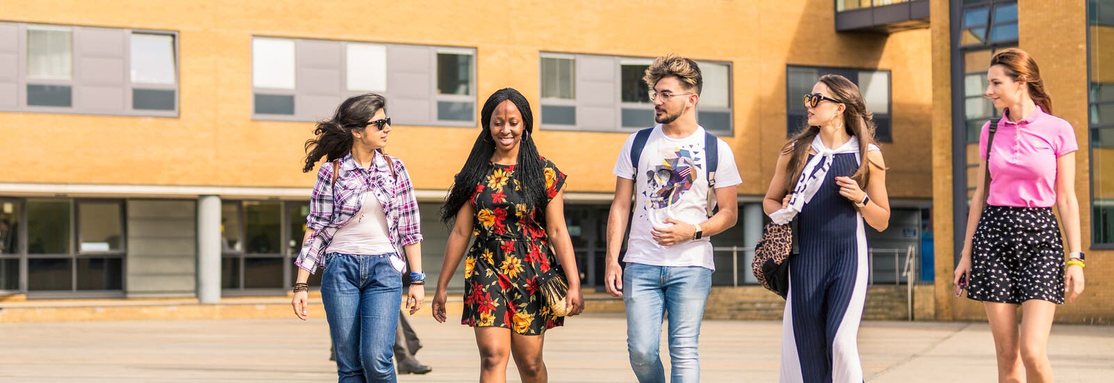A group of students walking outside campus