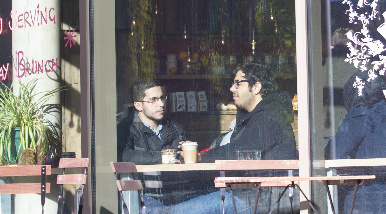 Two students sitting at a cafe