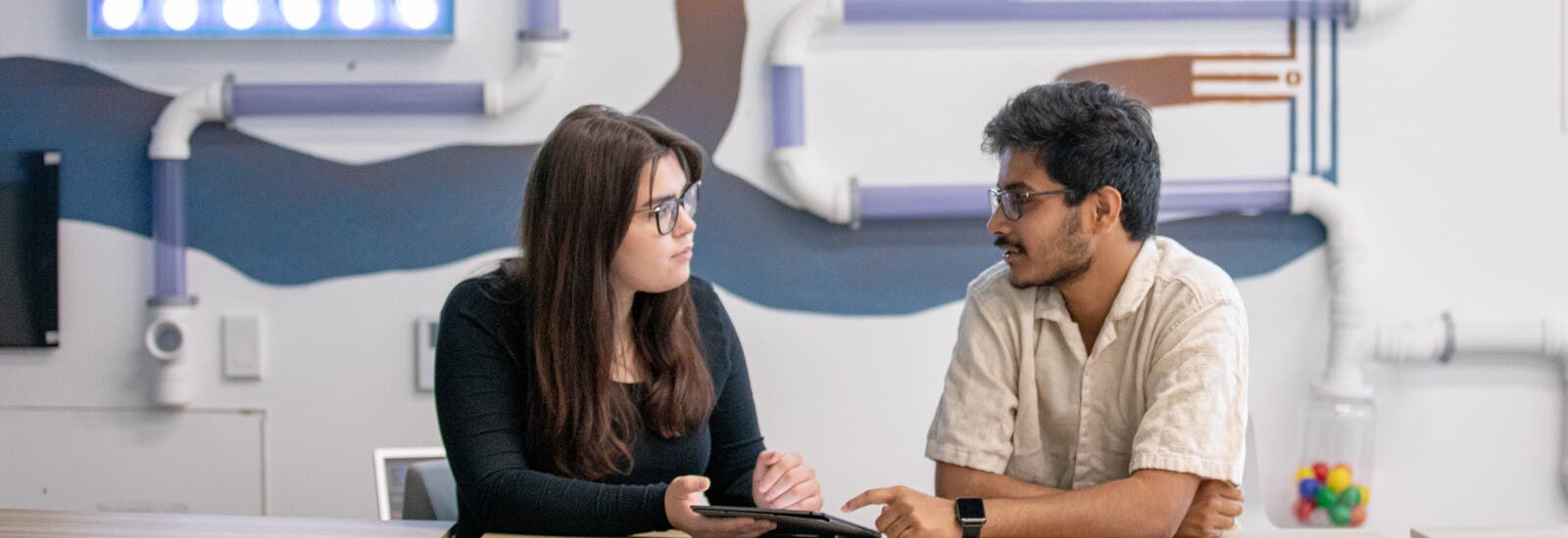 A student reading a book outside.