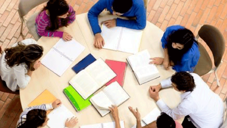 Birds eye view of students studying at table