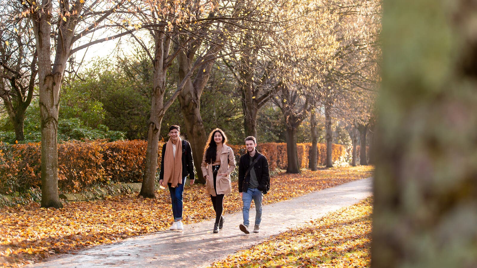 Three students walking together in Cardiff