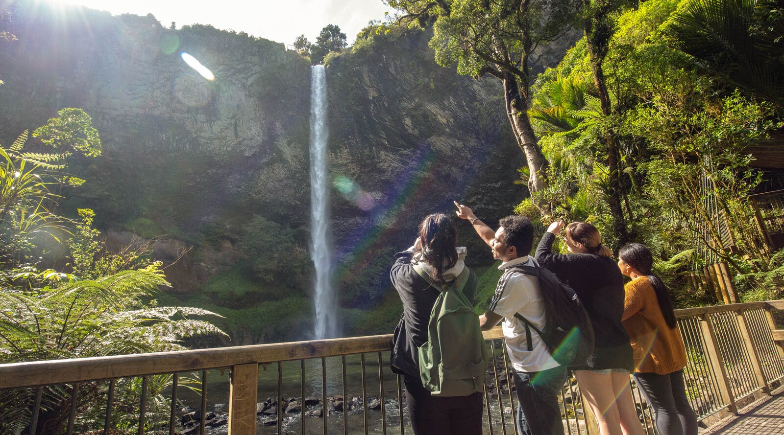Students visiting waterfall in Waikato