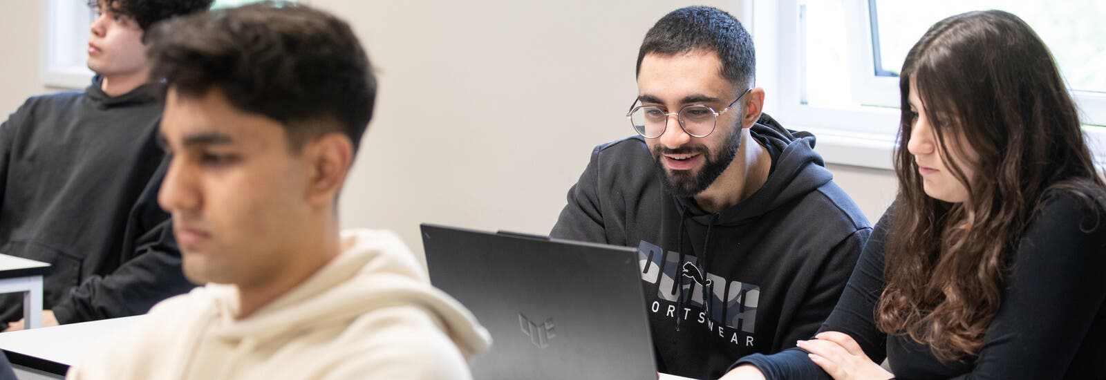 Sussex student smiling at the camera