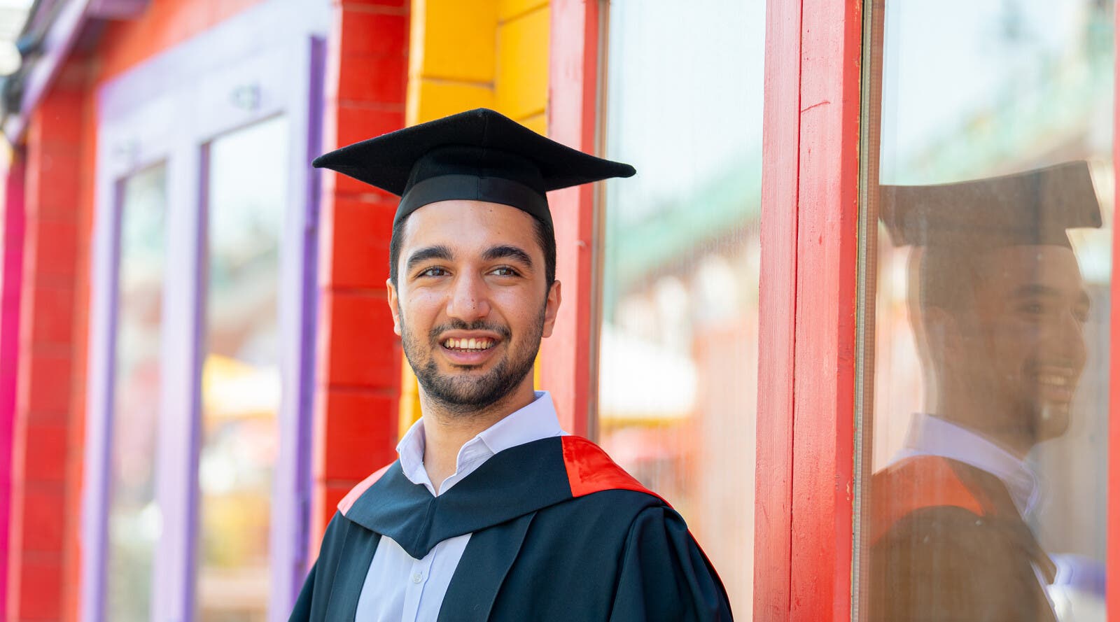 A student in graduation robes