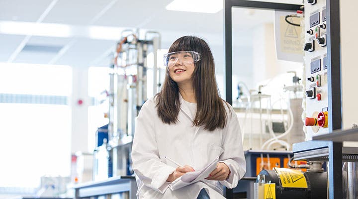 Student wearing goggles in lab
