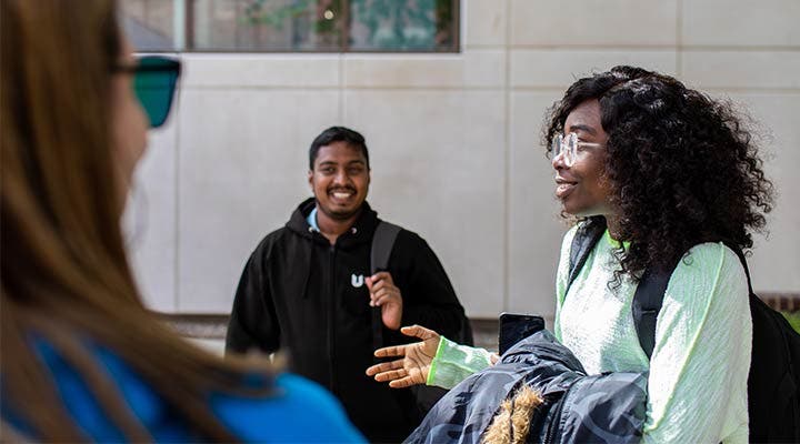 Students talking outside campus