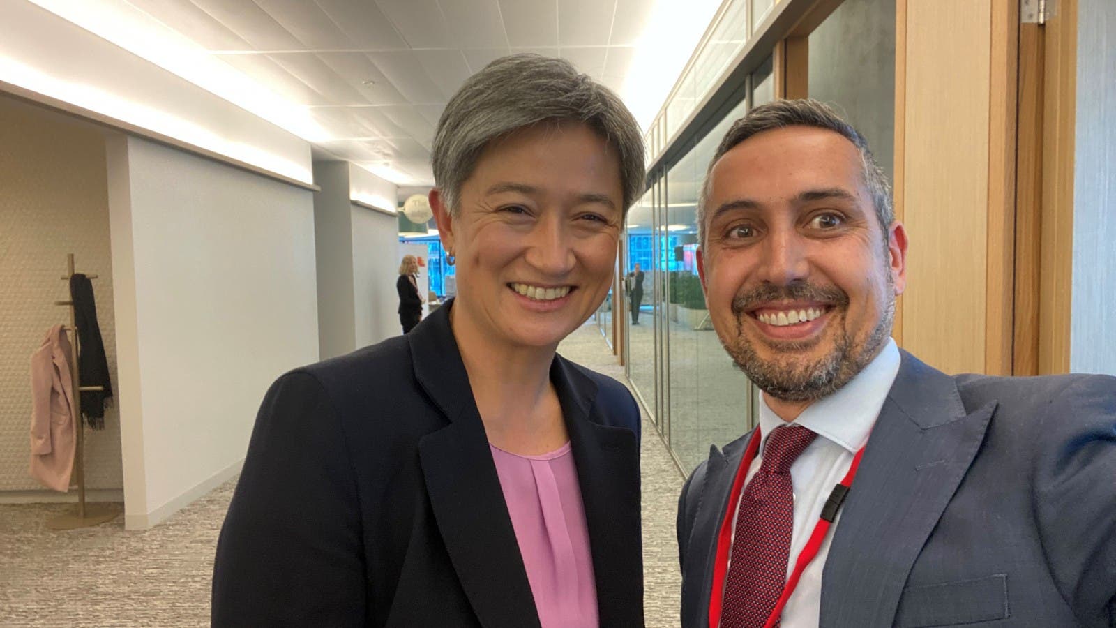 Alex Chevrolle and Penny Wong smiling.