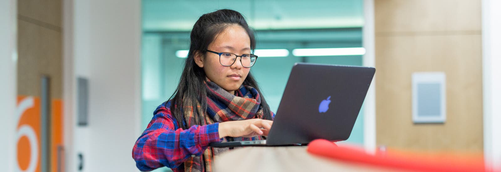 A student using a laptop.