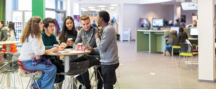 Students at table at the University of Huddersfield