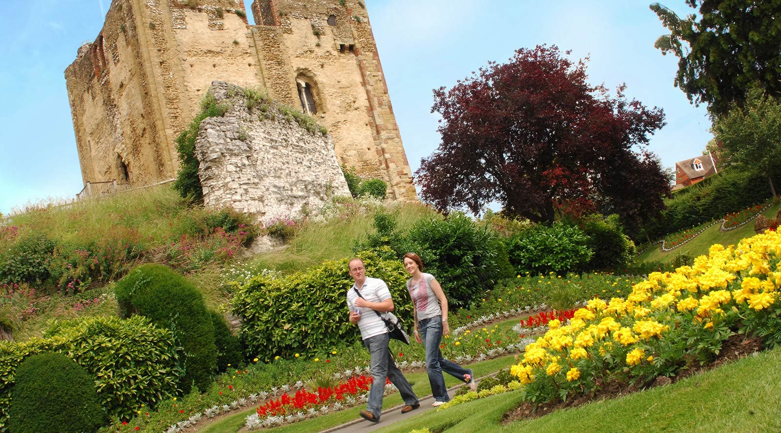 Students walking in front of castle in Surrey