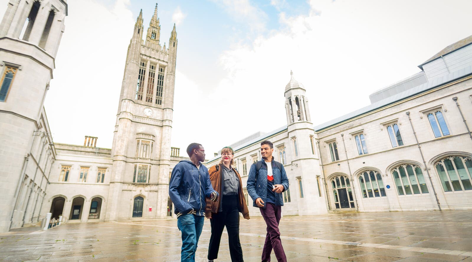 Three students walking through Aberdeen