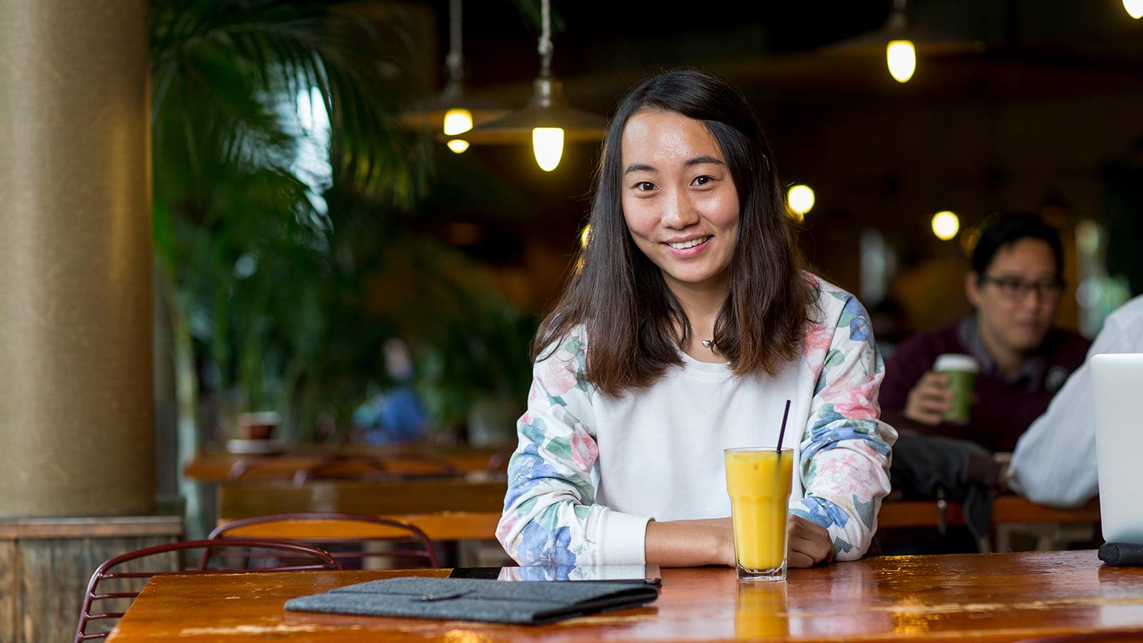 A Taylors Sydney student in a cafe