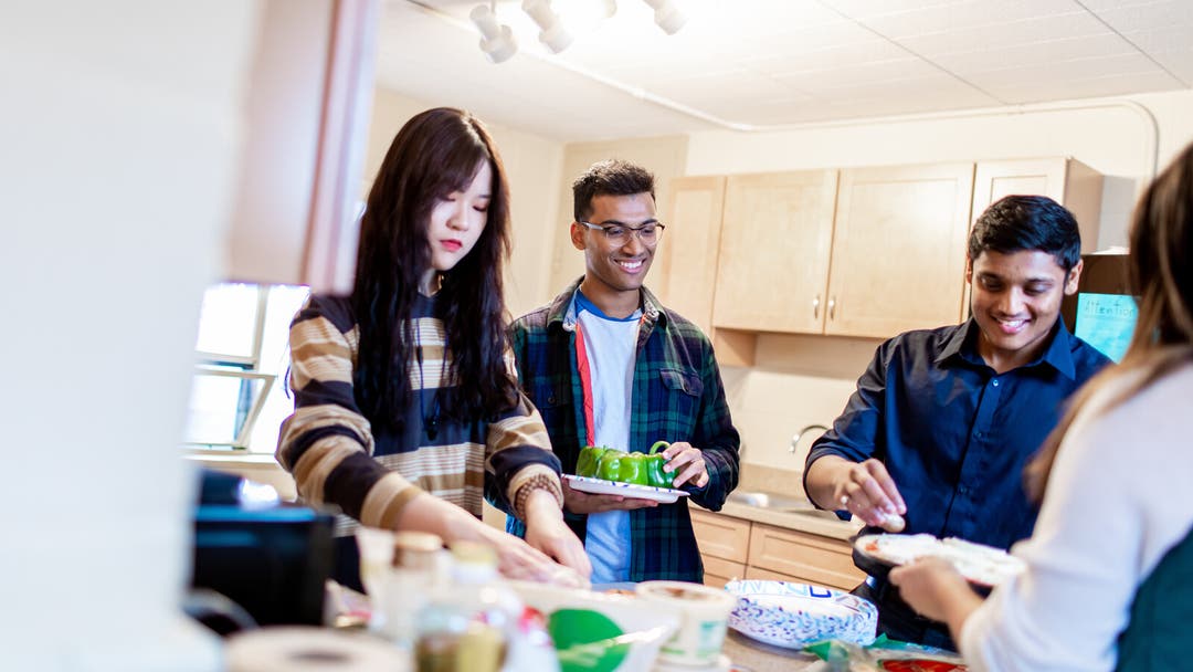 Students cooking in accommodation
