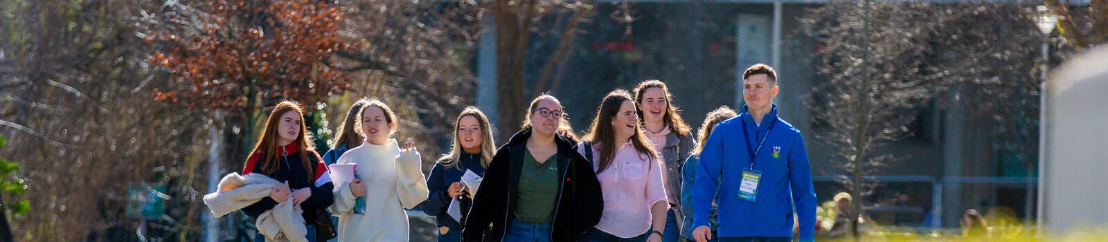 A group of students touring UCD's campus