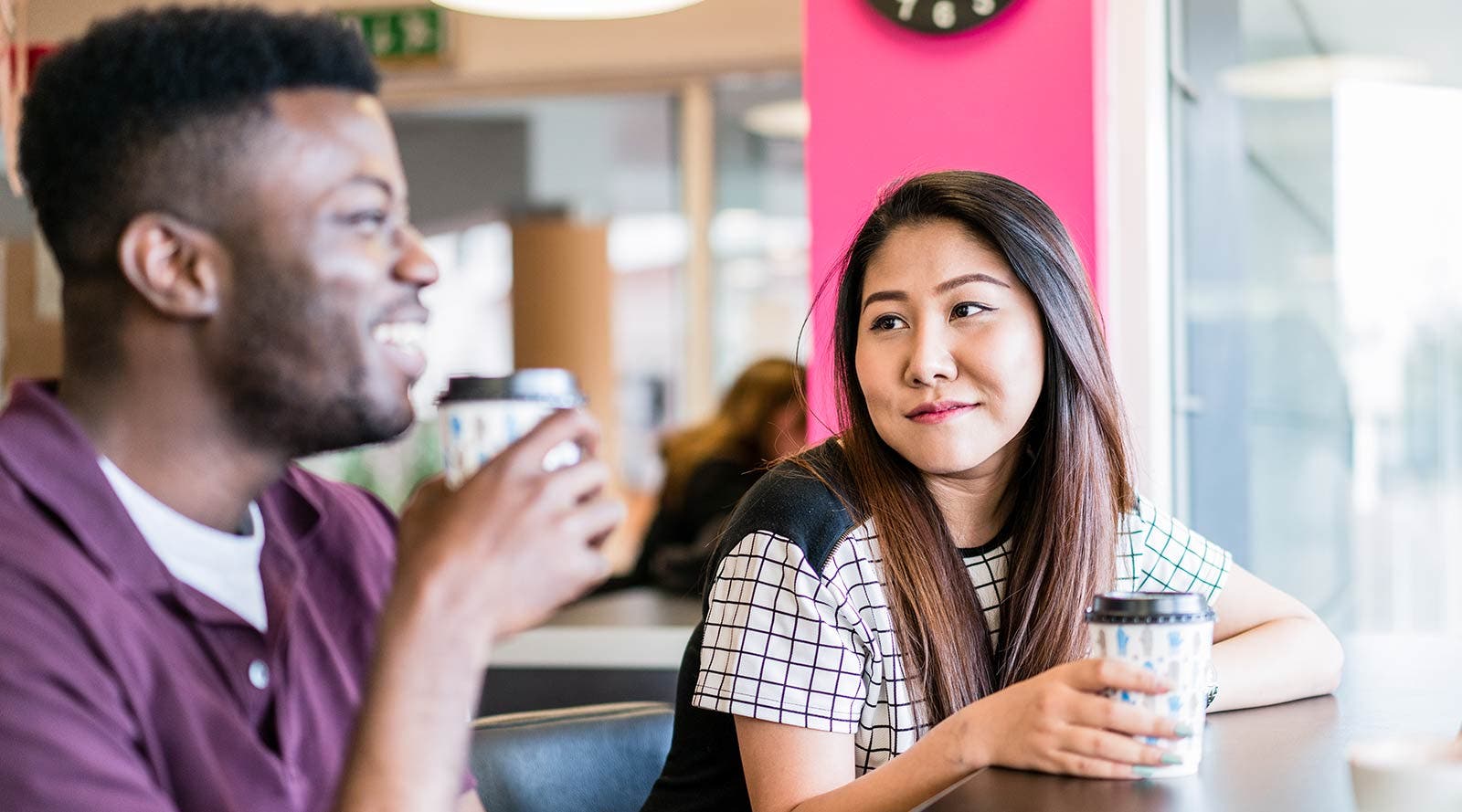 Surrey students drinking coffee together