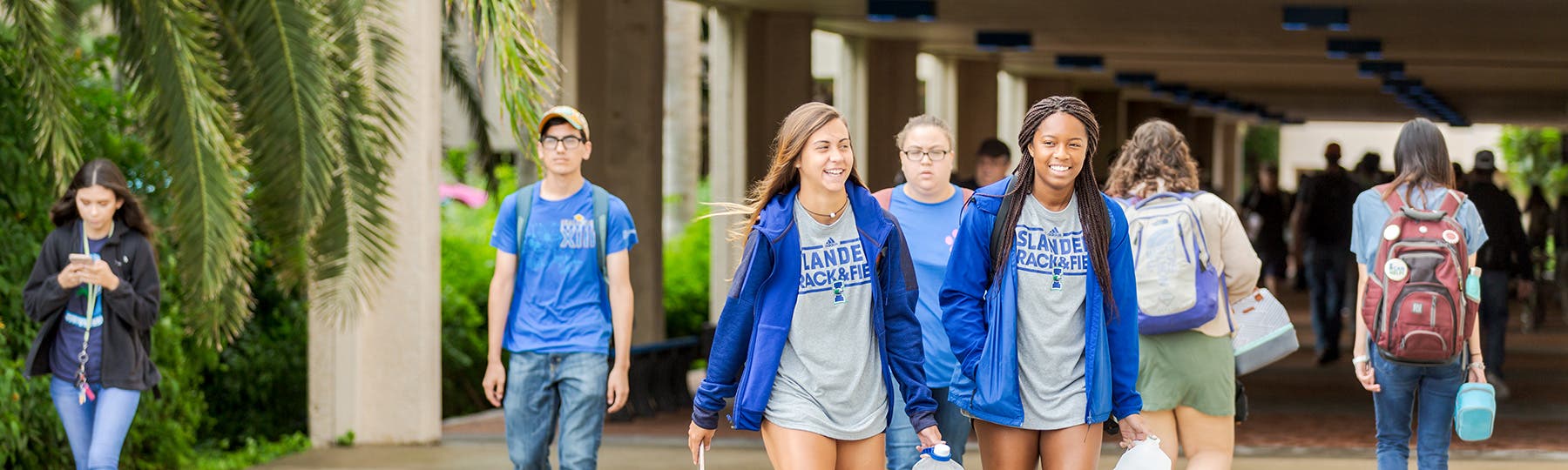 Students walking together wearing track uniforms